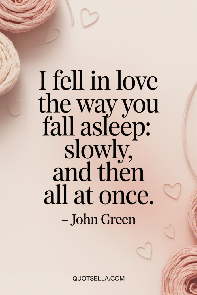 Romantic love quote by John Green reading “I fell in love the way you fall asleep: slowly, and then all at once,” designed with soft beige tones, subtle hearts, and elegant typography, Quotesella.com